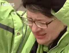 Person in green jacket screaming