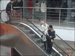 Woman runs up escalator