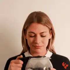 Woman drinking coffee from carafe