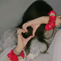 woman making heart shape with hands