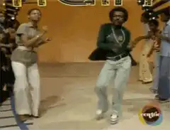 Man in green shirt dancing on Soul Train