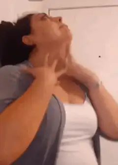 Woman rubbing her neck in pain