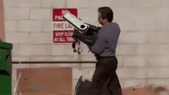 Andy Dumps Trash in Dumpster