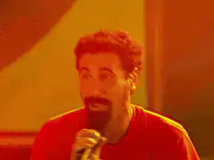 Comedian singing into microphone