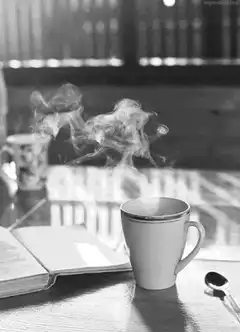 steaming coffee cup on table