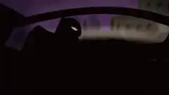 Batman in car headlights