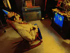 Clown rocking chair watching TV