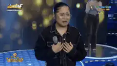 Woman crying on stage