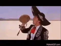 Man in sombrero drinks from bottle
