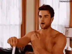 Shirtless man dancing excitedly
