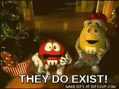 Santa Claus points at M&M's saying they exist