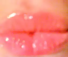 Blonde woman puckering lips