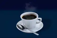 Steaming cup of black coffee