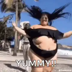 Woman dancing on beach YUMMY