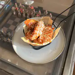 sesame chicken wings in basket