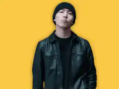 Man in beanie gives thumbs up