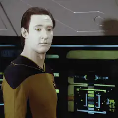 Jean-Luc Picard shrugs with pen