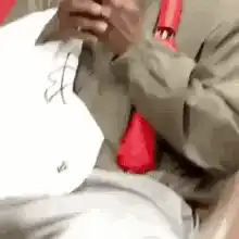 Man on subway with wide eyes looking at phone
