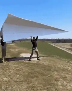 Man launches giant paper airplane