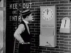 Man punches clock to get time