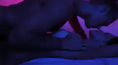 couple kissing in blue light