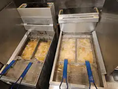 Commercial deep fryers bubbling