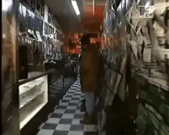 DJ scratching records in a record store