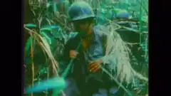 Soldiers marching through dense jungle
