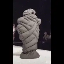 Michelin Man statue spinning