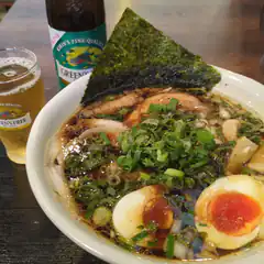 Bowl of ramen with beer