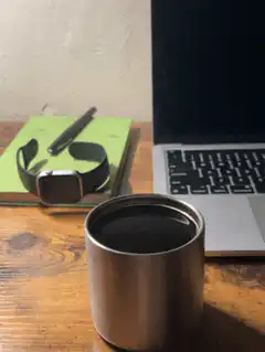 coffee cup on desk with laptop