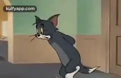 Tom sneaking with hands behind back