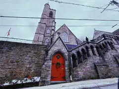 snowy church with red door