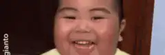 Asian boy laughing hysterically