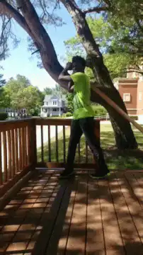 man in green shirt dancing on deck