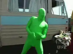 green man dancing in front of rv