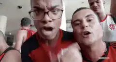 Two men in red jerseys making surprised faces