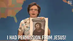 Samantha Bee holds Jesus permission sign