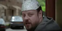 Man in tinfoil hat gives thumbs up
