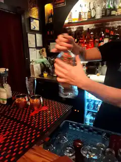 Bartender shaking cocktail shaker