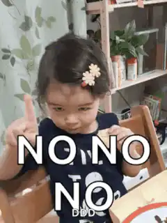 Toddler shaking finger saying no no no