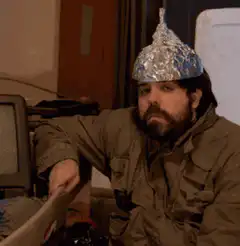 Man in tinfoil hat gives thumbs up