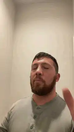 Man closes eyes and opens them