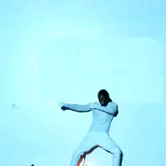 Man dancing on a glowing ball
