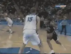 Basketball player blocks a shot