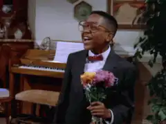 Eddie Murphy singing with flowers
