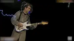 Tom Morello playing guitar with lightning