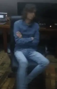 Man spinning in office chair