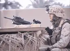 Soldier drops grenade on rooftop
