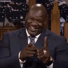 Shaquille O'Neal pointing and laughing